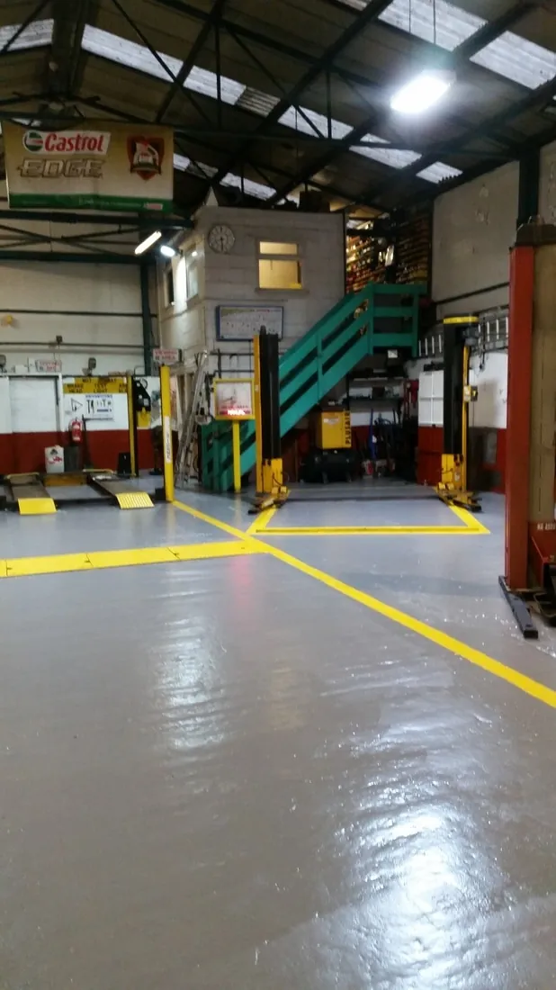 An interior view of the garage and its work areas